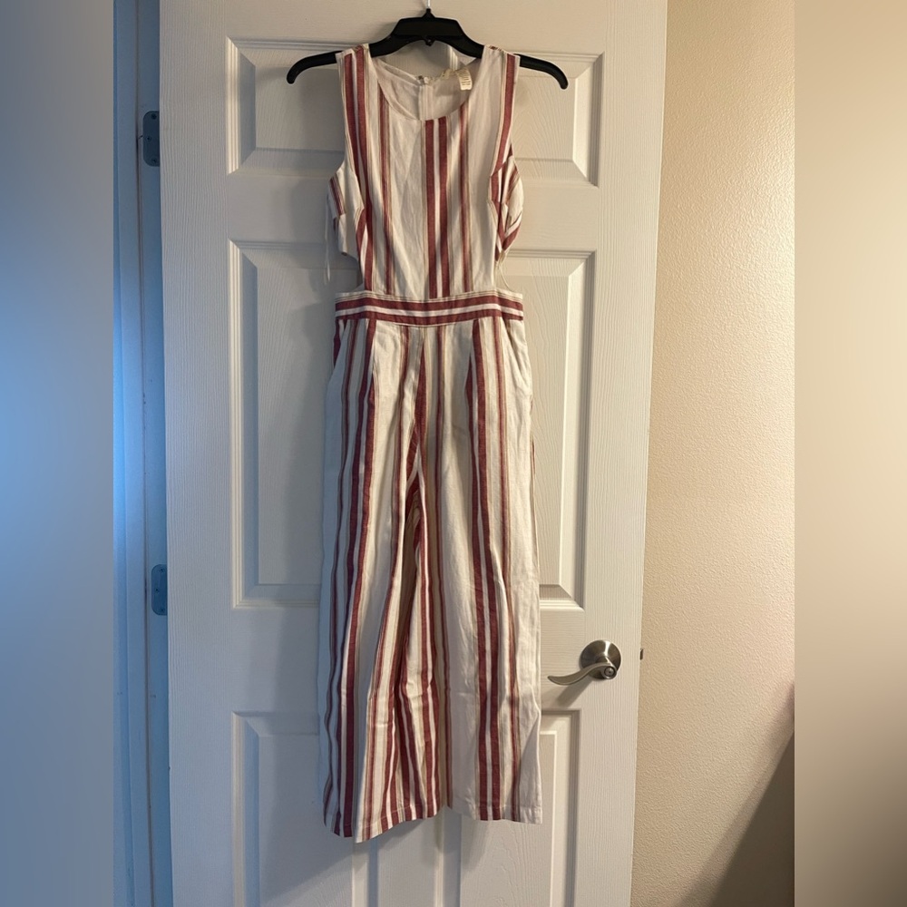 Striped jumper, with side cut outs. Never worn. Has pockets